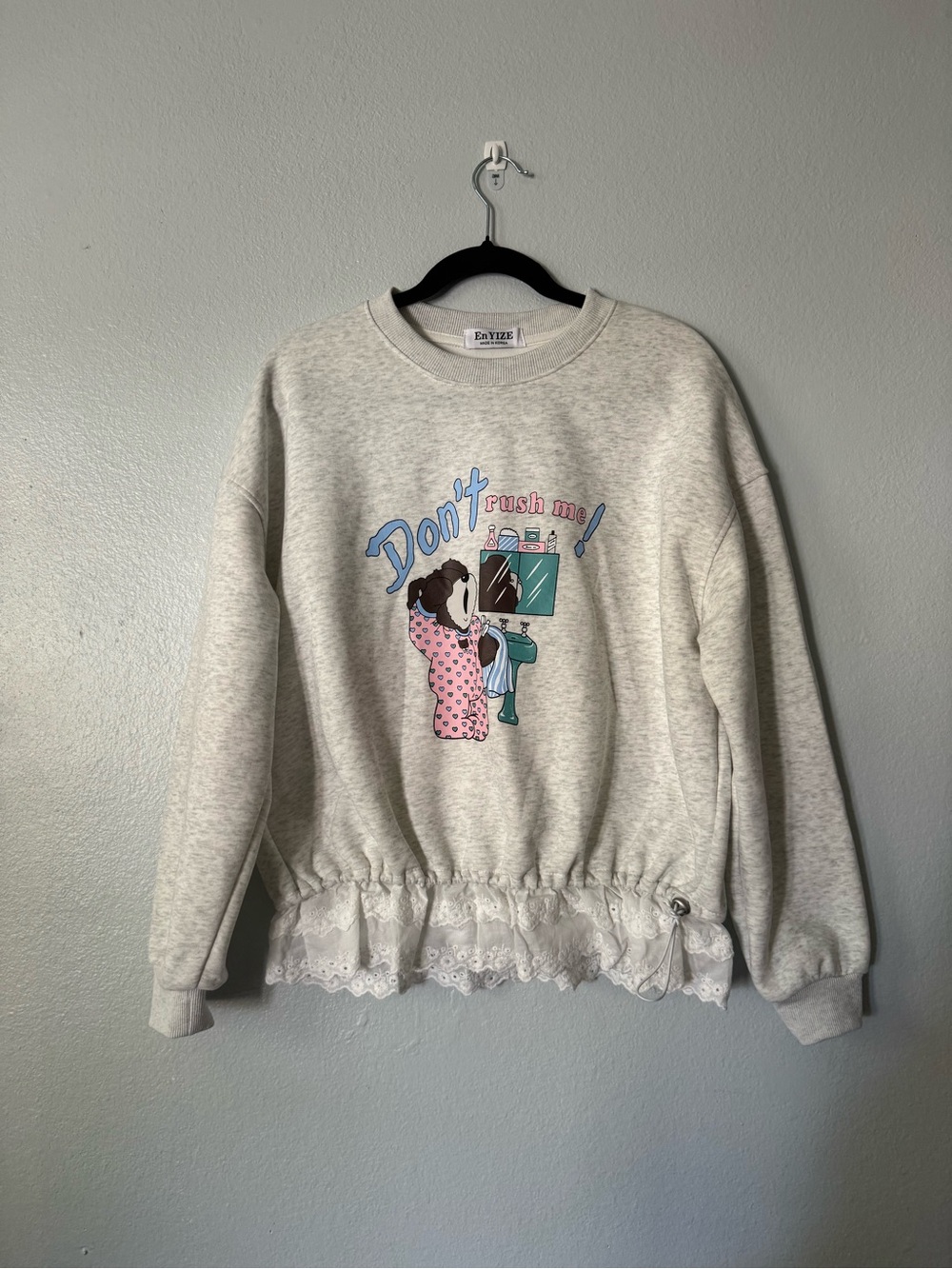En YIZE Korean “Don’t Rush Me!” Dog Graphic Sweatshirt with Ruffle Hem